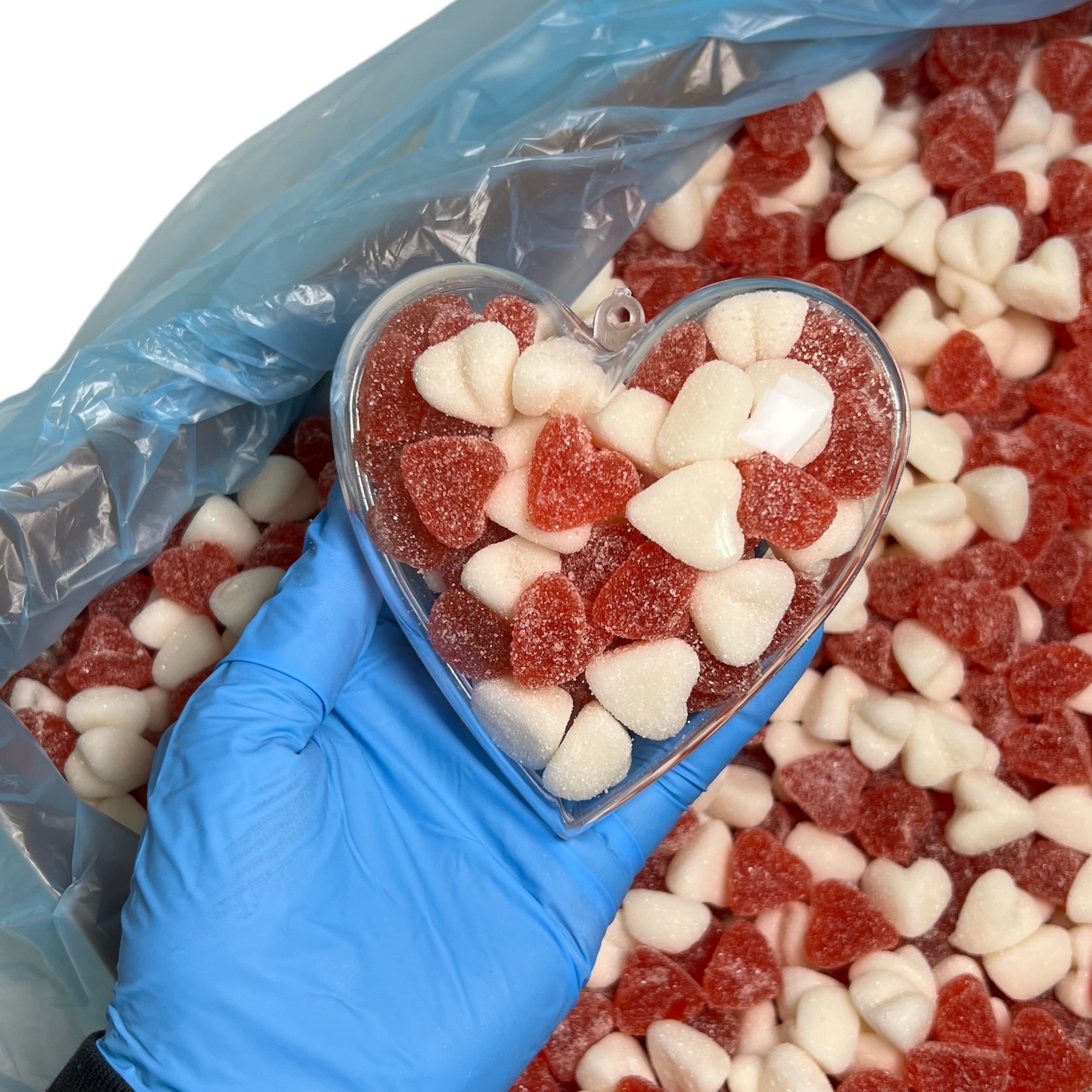 Plastic hart gevuld met fruit snoepjes